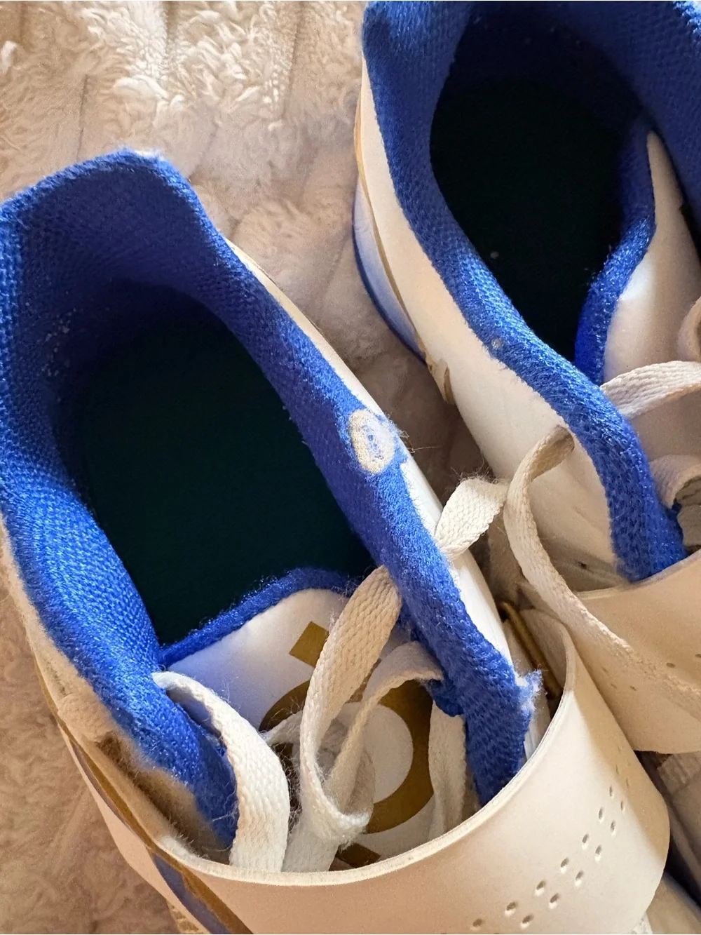 Nike White Sneakers with Blue and Gold Accents